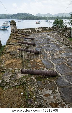 June 12 2016 Portobelo Panama: snall boats floating in the bay by Fort San Fernando