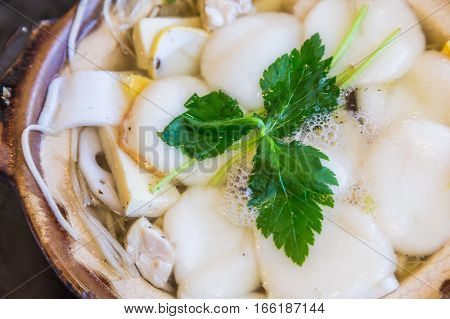 Traditional Shimabara Guzoni - Soup With Rice Cake And Seafood