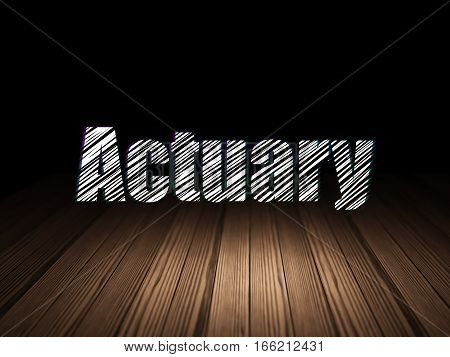 Insurance concept: Glowing text Actuary in grunge dark room with Wooden Floor, black background