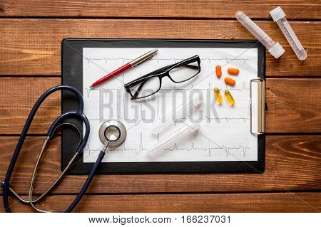 doctor workplace at wooden table with microscope in lab top view no one