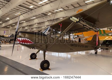 Santa Ana CA USA - January 21 2017: Army green Cessna O-1E airplane called birddog with a mouth with teeth displayed at the Lyon Air Museum in El Santa Ana California United States. It was used during World War II. Editorial use only.