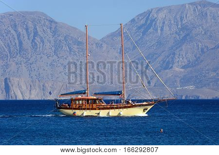 AGIOS NIKOLAOS, CRETE - SEPTEMBER 17, 2016 - Large yacht with two masts in the bay with mountains to the rear Agios Nikolaos Crete Greece Europe, September 17, 2017.