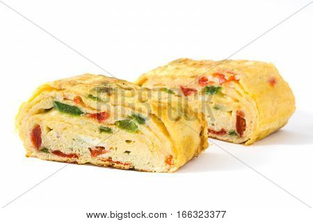 Traditional tamagoyaki Japanese omelette isolated on white background