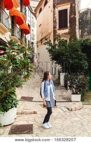 Young Girl With Backpack Exploring Sperlonga, Italy
