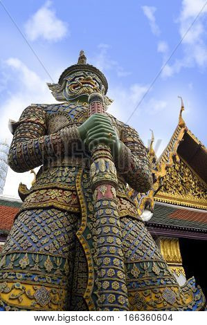 view of famous religion temple wat phra prakaew grand palace in Bangkok Thailand under a blue sky in travel and tourist destination landmark in Asia