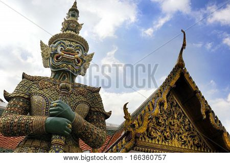view of famous religion temple wat phra prakaew grand palace in Bangkok Thailand under a blue sky in travel and tourist destination landmark in Asia