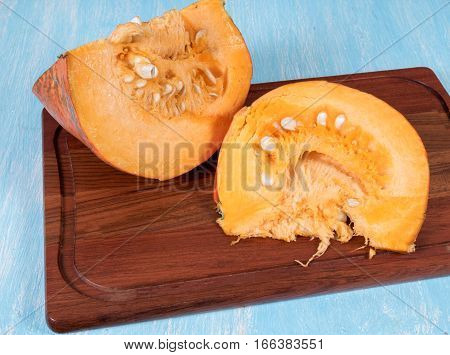 Pumpkin sliced on a cutting board kitchen