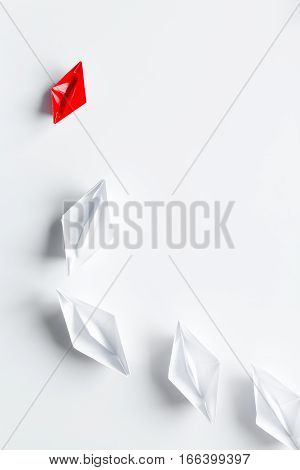 choice concept paper boats on white background top view.