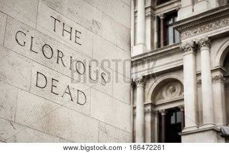 Detail from the Cenotaph on Whitehall London with focus on the phrase 'The Glorious Dead'.