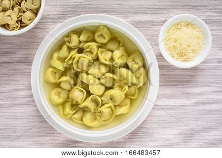 Traditional Italian Tortellini in Brodo (broth) soup photographed overhead with natural light