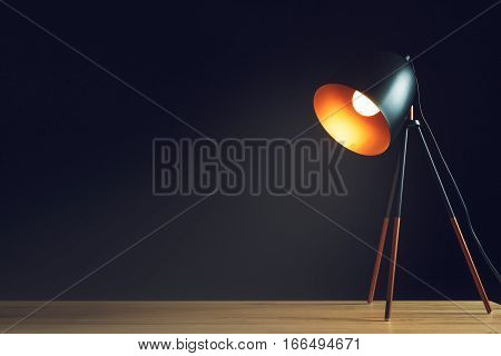 Desk lamp on empty wooden office table as space for text or product placement