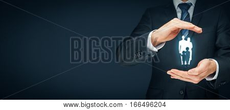 Family life insurance, family services and supporting families concepts. Businessman with protective gesture and silhouette representing young insured family.