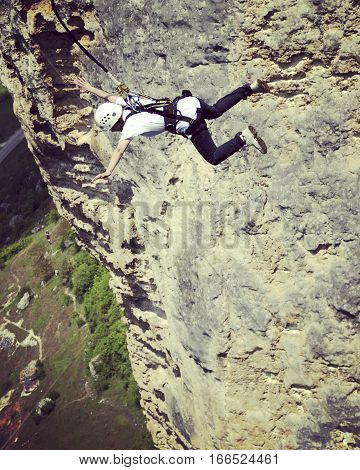 Jump off a cliff into a canyon with a rope.