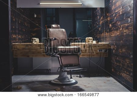 Stylish Vintage Barber Chair In Wooden Interior. Barbershop Theme