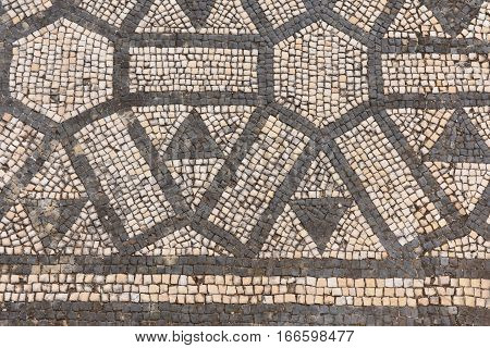 Geometric mosaic of the roman ruins of the ancient city of Conimbriga Beiras region Portugal