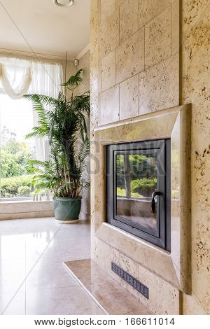 Travertine Fireplace Next To Big Window
