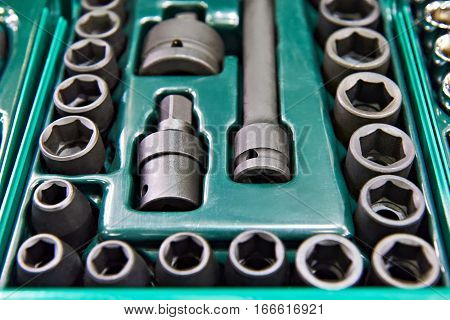 The socket wrenches in plastic box closeup