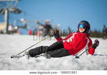 Woman Skier With Ski At Winer Resort In Sunny Day