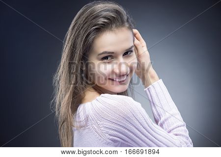 Natural Portrait of Sensual Smiling Caucasian Brunette Woman With Beautiful Long Hair. Posing Against Black background. Horizontal Image