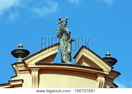 Statue of Mercury the Roman god of commerce located on the roof of the first Croatian Savings Bank Virovitica Croatia