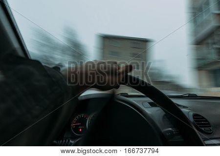 Riding behind the wheel of a car in winter. first-person view