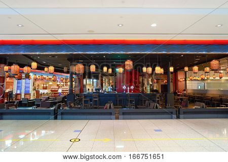 DUBAI, UAE - CIRCA NOVEMBER, 2016: inside Dubai Airport. There are a lot of restaurants, bars, cafes and shops in Dubai International Airport. Almost all of them are open twenty-four hours.
