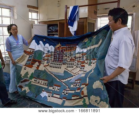 DHARAMSALA, INDIA. 2 June 2009: The Norbulingka Institute. Craftsmen show a beautiful traditional Tibetan embroidery. Western Himalaya, Himachal Pradesh, district of Kangra.
