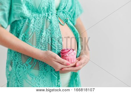 Portrait young pregnant woman with a flower