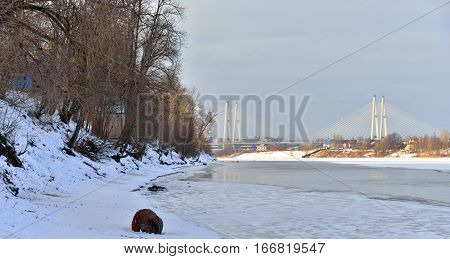 Coast of Neva River and Cable stayed bridge on the outskirts of St. Petersburg at winter Russia.