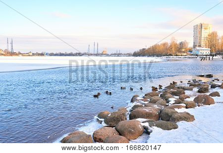 View of Neva River on the outskirts of St. Petersburg at sunny winter day Russia.