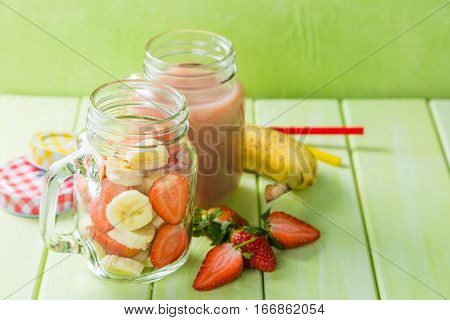 Banana and strawberry smoothie, inredients, copy space