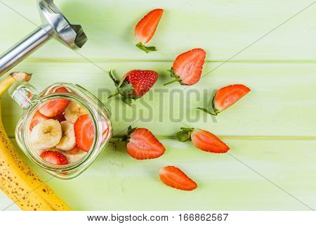Banana and strawberry smoothie, inredients, copy space
