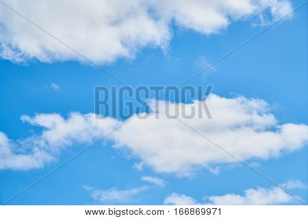 Beautiful Blue Sky with Fluffy Clouds Background