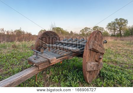 Vintage multi barrelled cannon - ribaudequin. Rear view of the open countryside