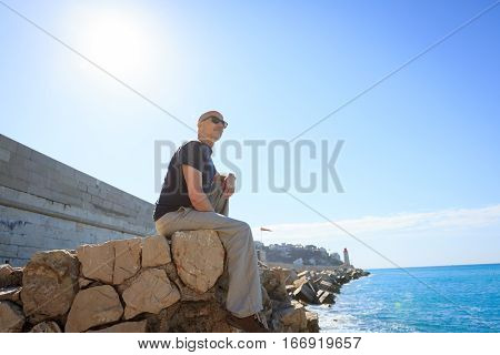 Tourist to Nice enjoying the sight near the habor