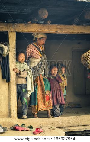 Woman With Three Children In Nepal