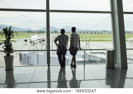 Airline Passengers Silhouettes At Airport