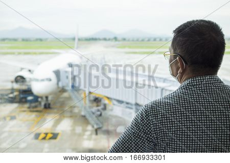 Person Wearing Protective Mask Against Transmissible Infectious Diseases And As Protection Against P