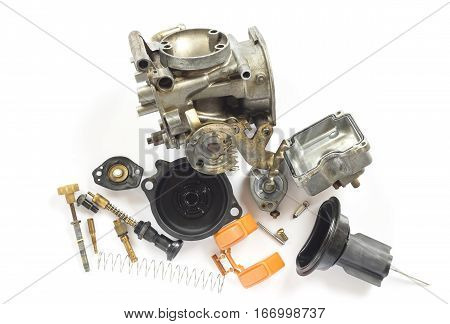 Old carburetor of motorcycle part disassembly isolate on white background.