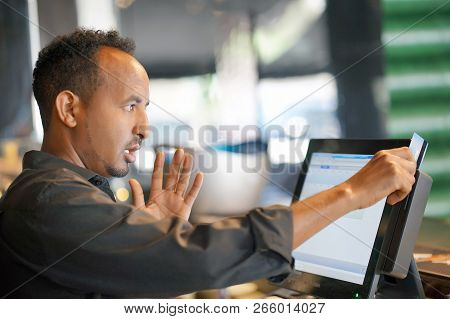 Male Bartender Made A Mistake In The Bill, Emotion. A Barmaid Registrating New Order By Cash-registe