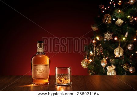 No Logo Or Trademark! Self Made Labels!  View Of Glass With Ice And Whiskey And A Bottle Aside.