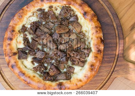 Turkish Round Pide With Meat Kavurma And Cheese.