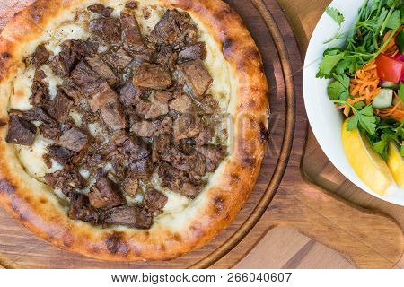 Turkish Round Pide With Meat Kavurma And Cheese.