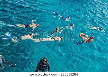 Hurghada, Egypt - February 24, 2017: Group Of People, Adults And Children, With Diving Masks And Sno