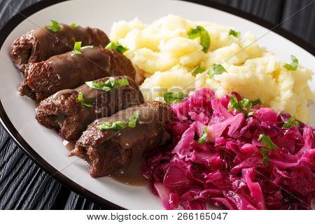 Beef Rouladen Or Rinderrouladen German Classic Dish Served With Mashed Potato And Red Cabbage Close-