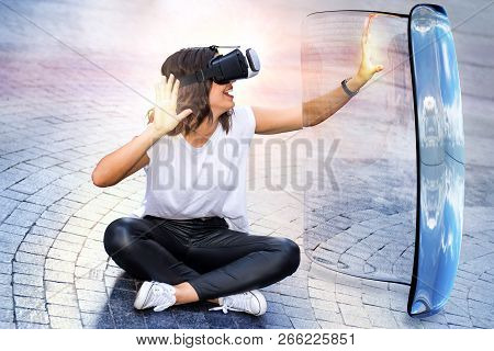 Conceptual Portrait Of Young Woman Wearing Virtual Reality Glasses. Girl Touching Big Transparent Gl