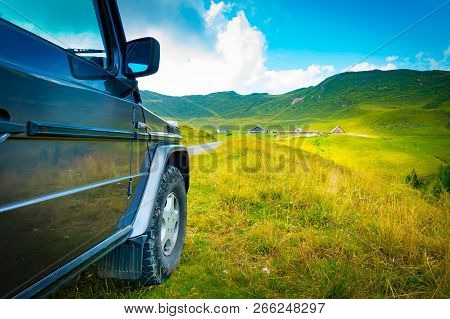 Low Angle View Of An Off Road Vehicle On A Mountain Road In The Giulian Alps, Friuli, Italy