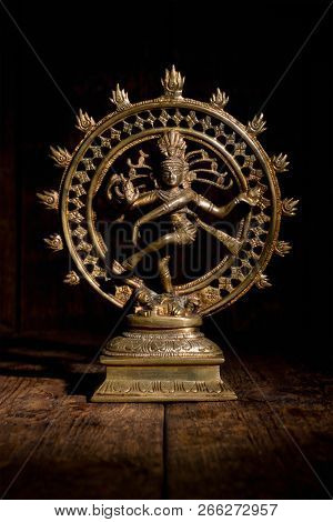 Statue of indian hindu god Shiva Nataraja - Lord of Dance on wooden background
