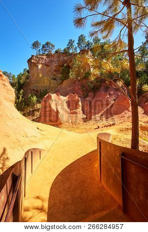 Red Ocher Cliffs In The Village Of Roussillon In Provence, France