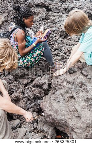 Pacaya, Guatemala - Mar 28, 2016: Tourists Roasting Marshmallow At The Lava Field Of Pacaya Volcano,